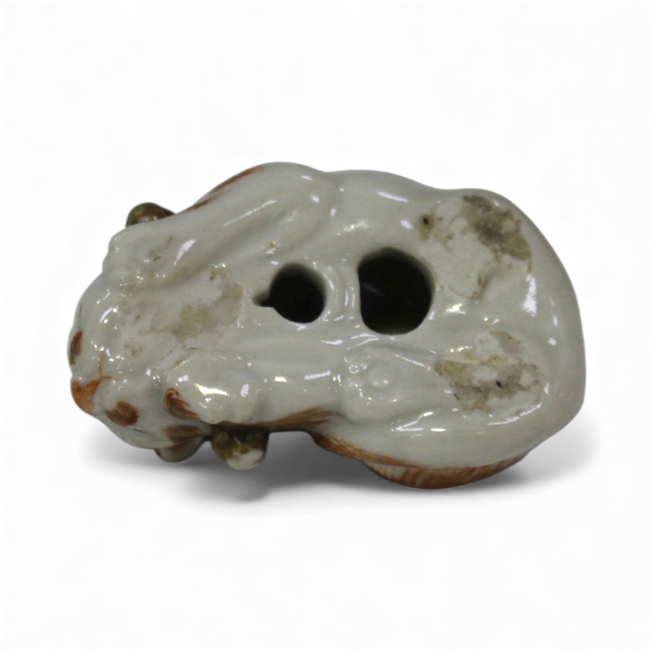 A Rare Japanese Kutani Porcelain Netsuke of a Sleeping Cat Meiji period