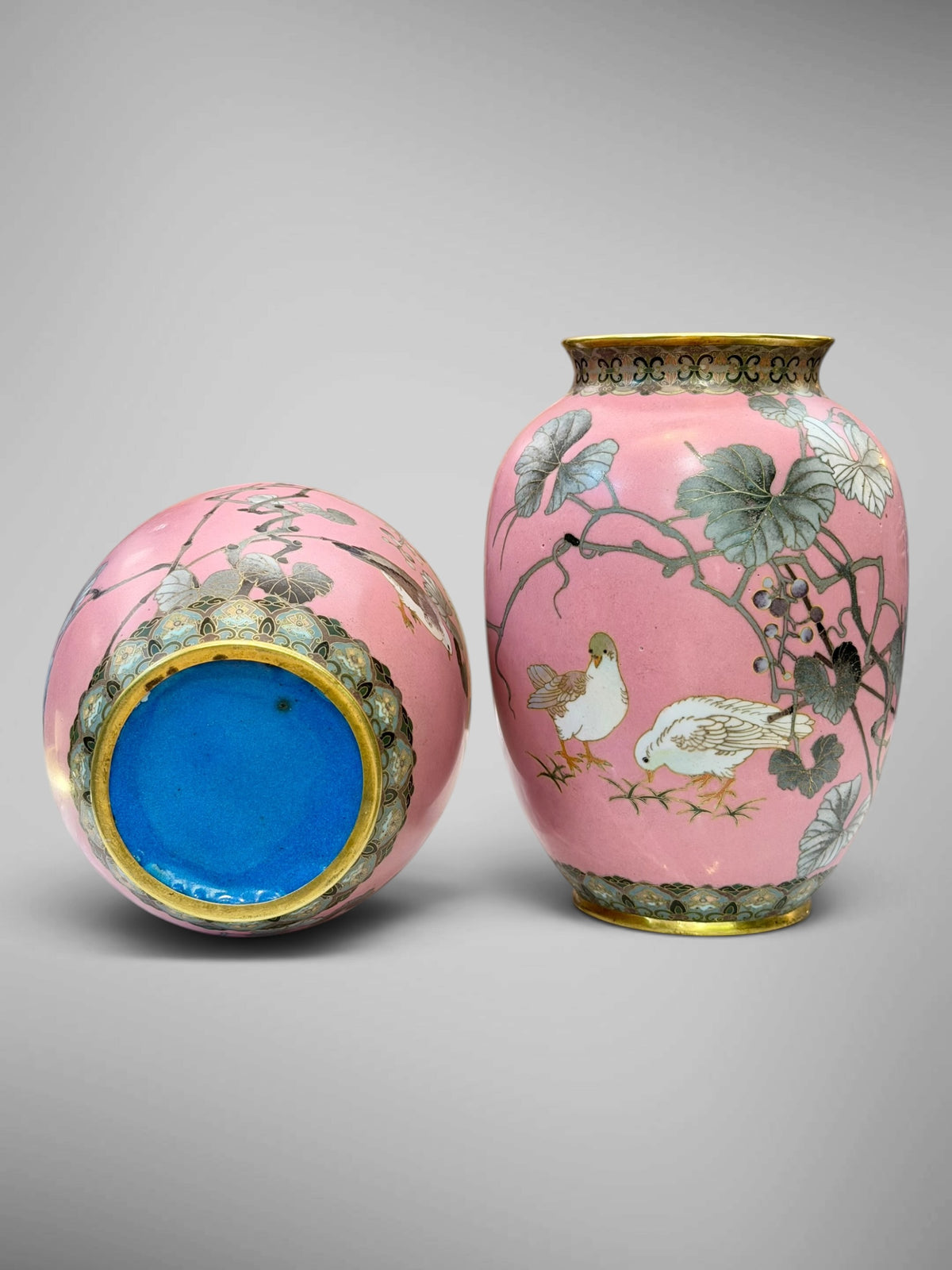 A FINE PAIR OF JAPANESE CLOISONNÉ ENAMEL VASES WITH BIRDS AND GRAPEVINE, IN THE MANNER OF NAMIKAWA SŌSUKE-Meiji period