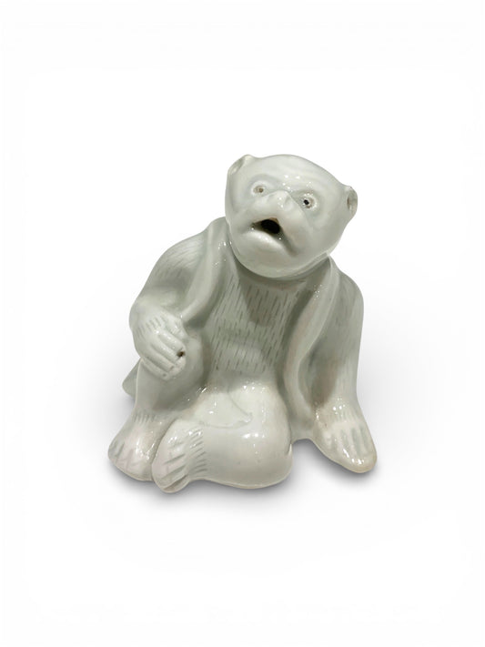 A Japanese Hirado Porcelain Suiteki (Water Dropper) in the Form of a Monkey
Meiji period,