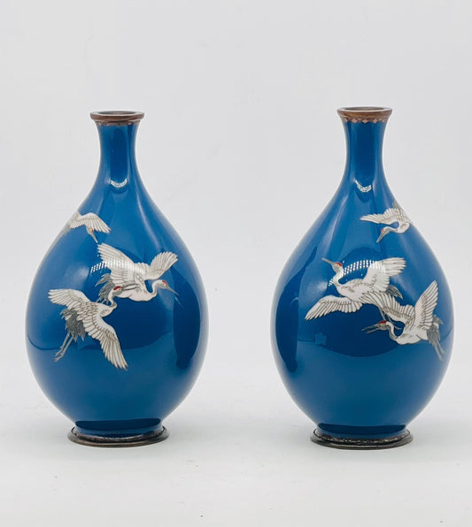 A Fine Pair of Japanese Cloisonné Enamel Vases with Cranes on a Teal-Blue Ground, Meiji period