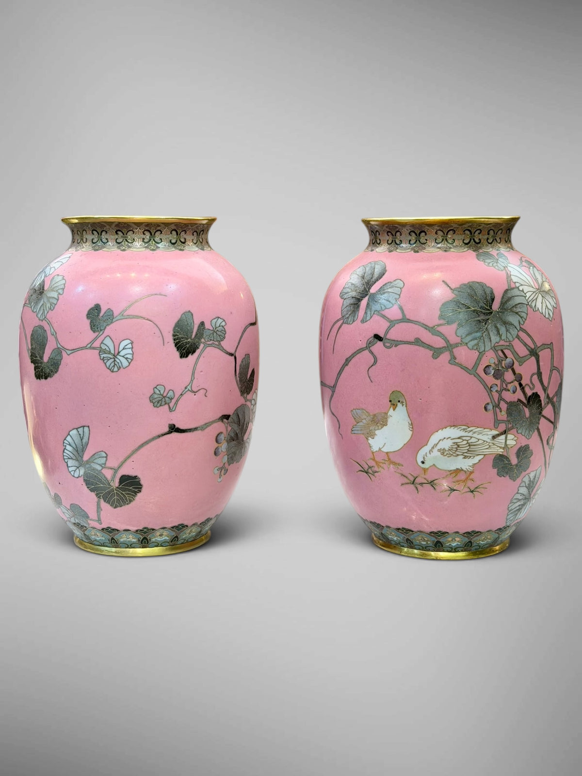 A FINE PAIR OF JAPANESE CLOISONNÉ ENAMEL VASES WITH BIRDS AND GRAPEVINE, IN THE MANNER OF NAMIKAWA SŌSUKE-Meiji period