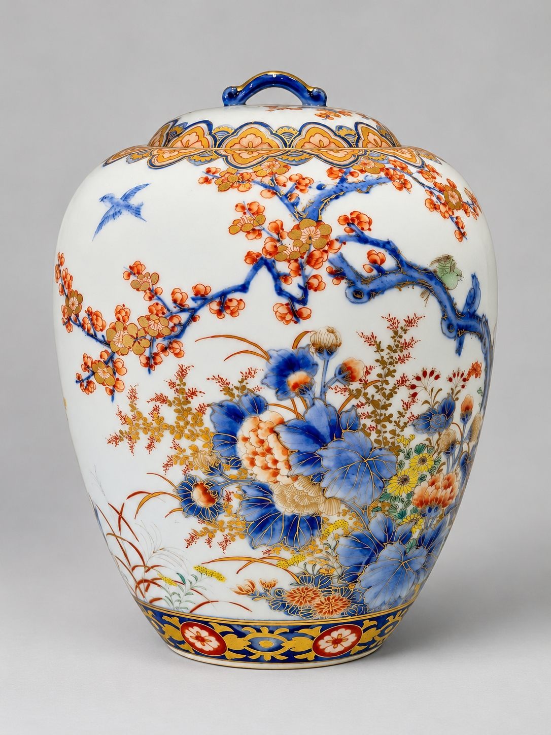 A Fine Fukagawa Porcelain Covered Jar with Prunus, Chrysanthemums and Birds.     Meiji period