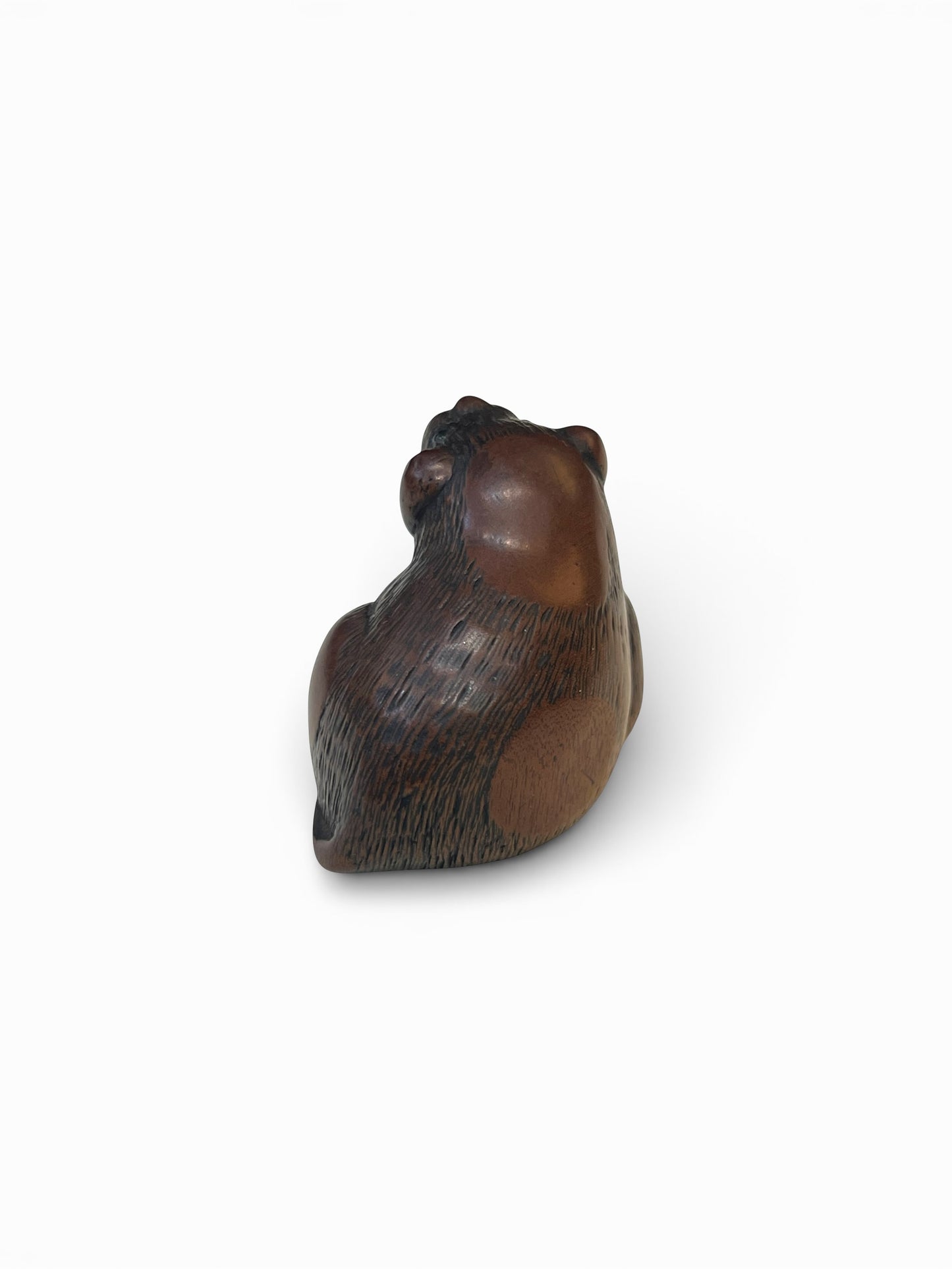 A Japanese Wood Netsuke of a Seated Puppy-Signed Masanao (正直)Japan, Late Edo to Early Meiji period,