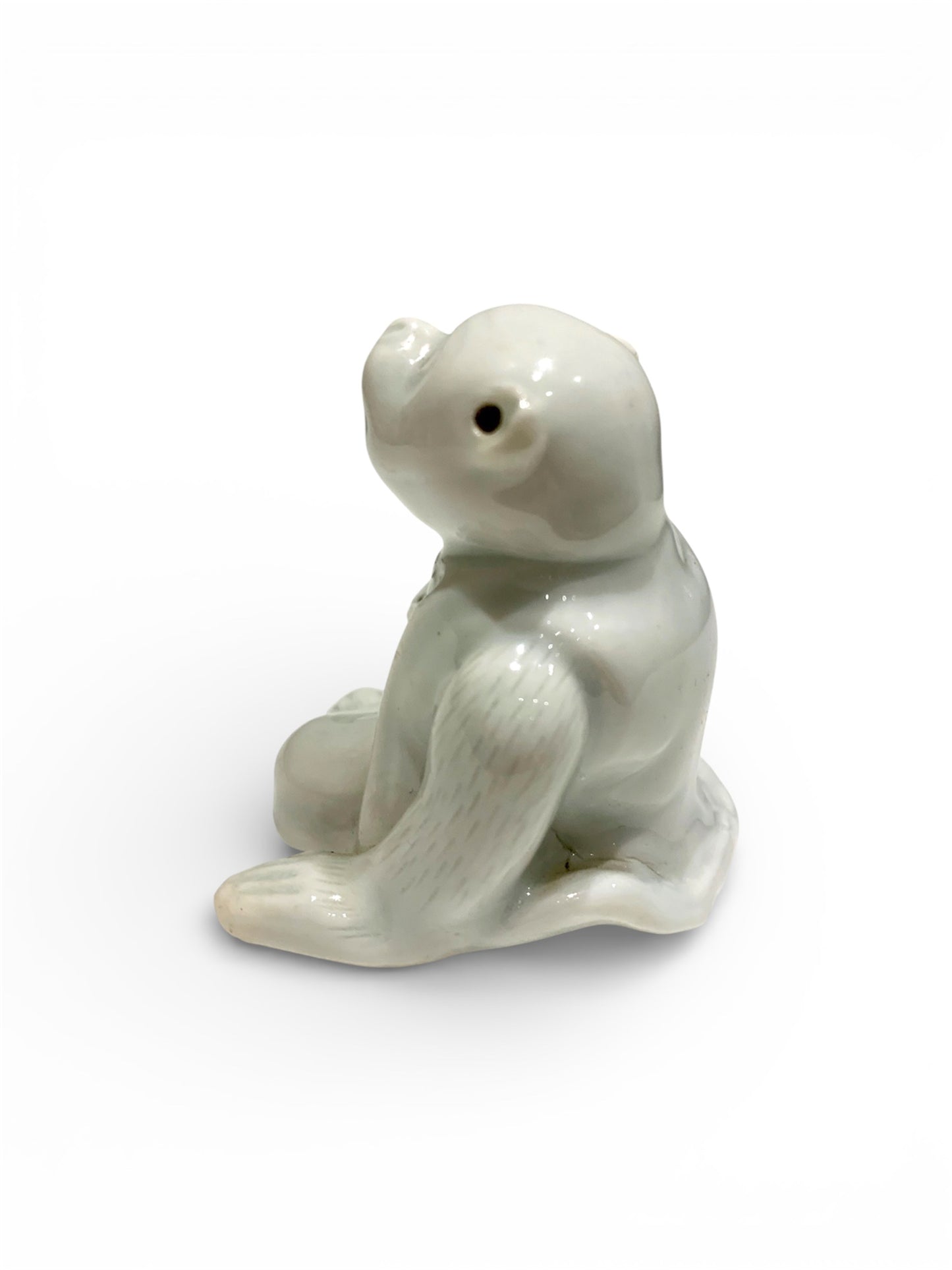 A Japanese Hirado Porcelain Suiteki (Water Dropper) in the Form of a Monkey
Meiji period,