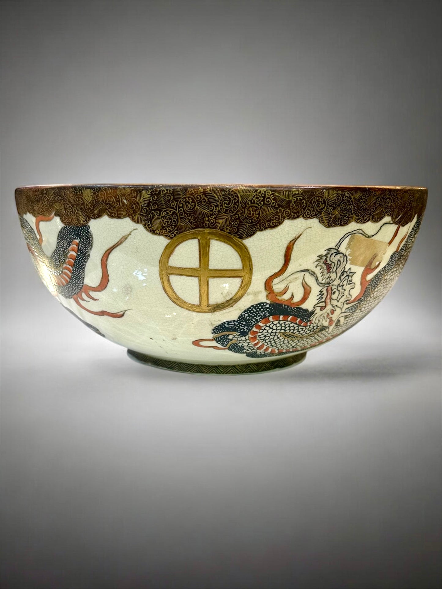A Large Japanese Satsuma Bowl -Dragon and 100 Rakan. Signed .Meiji Era