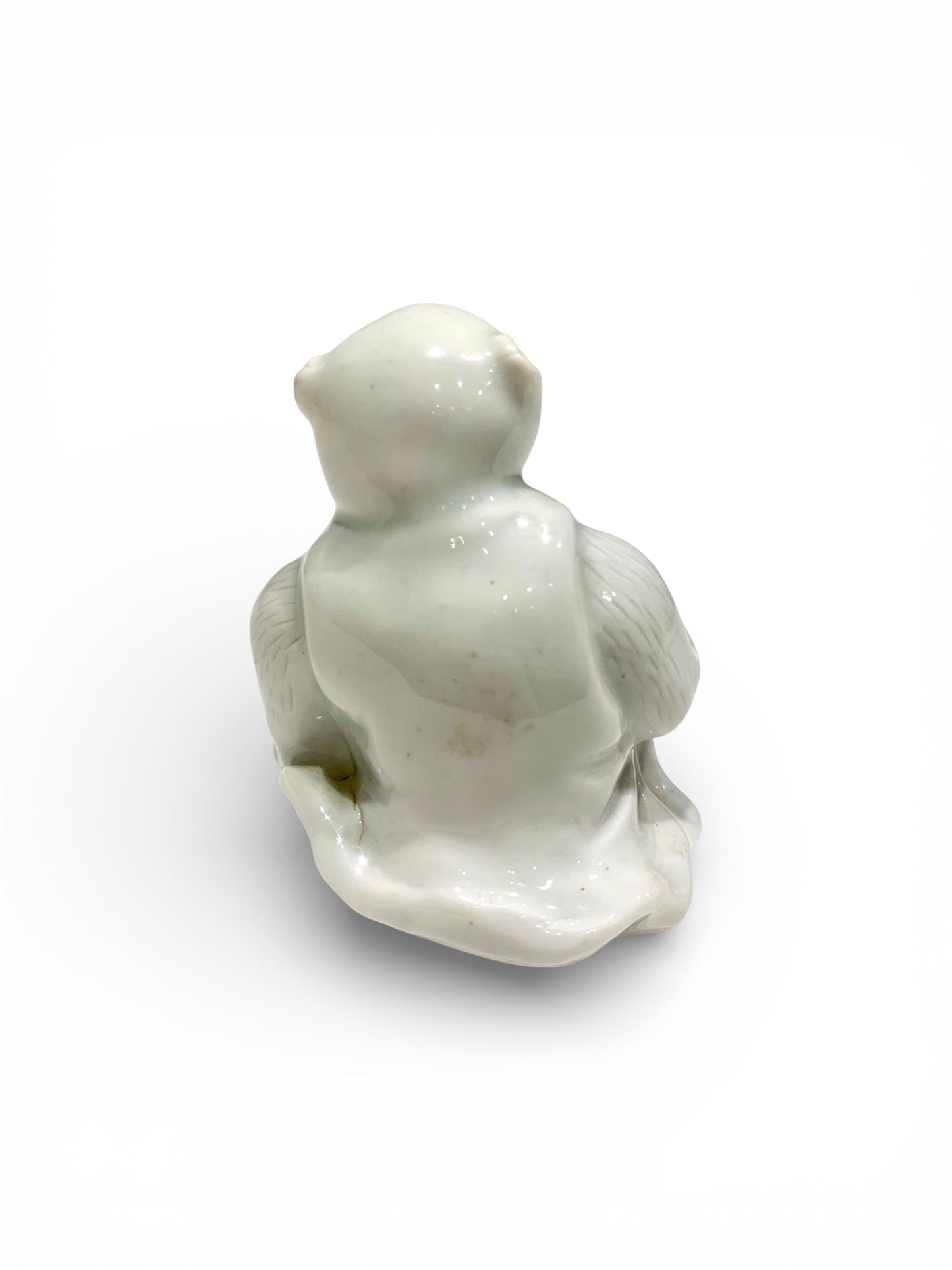 A Japanese Hirado Porcelain Suiteki (Water Dropper) in the Form of a Monkey
Meiji period,