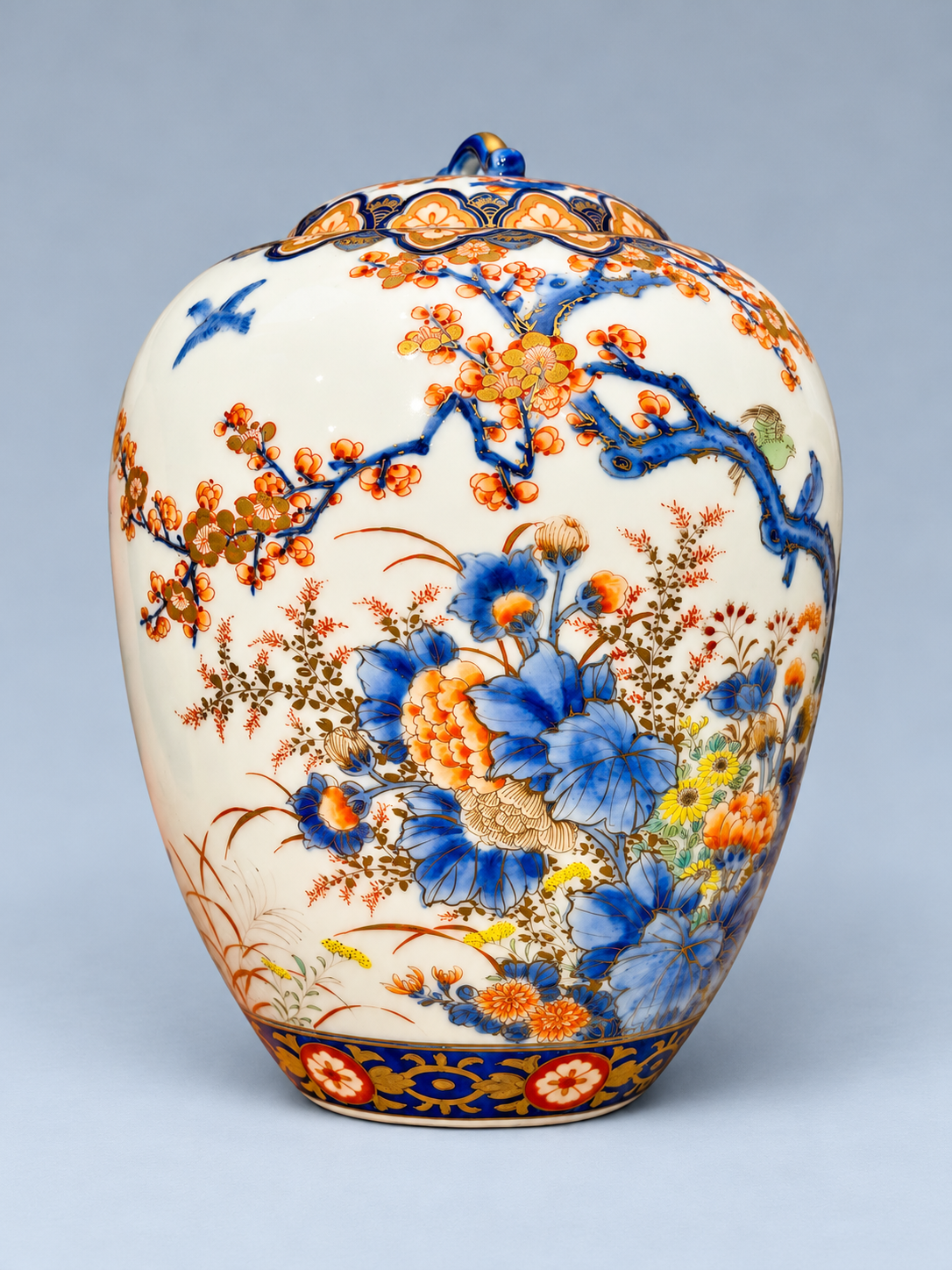 A Fine Fukagawa Porcelain Covered Jar with Prunus, Chrysanthemums and Birds.     Meiji period