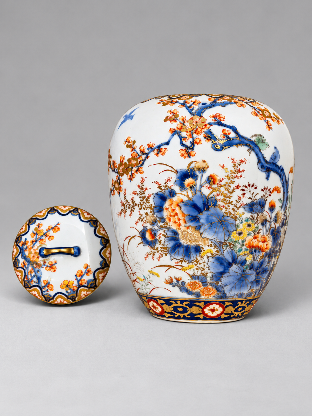 A Fine Fukagawa Porcelain Covered Jar with Prunus, Chrysanthemums and Birds.     Meiji period
