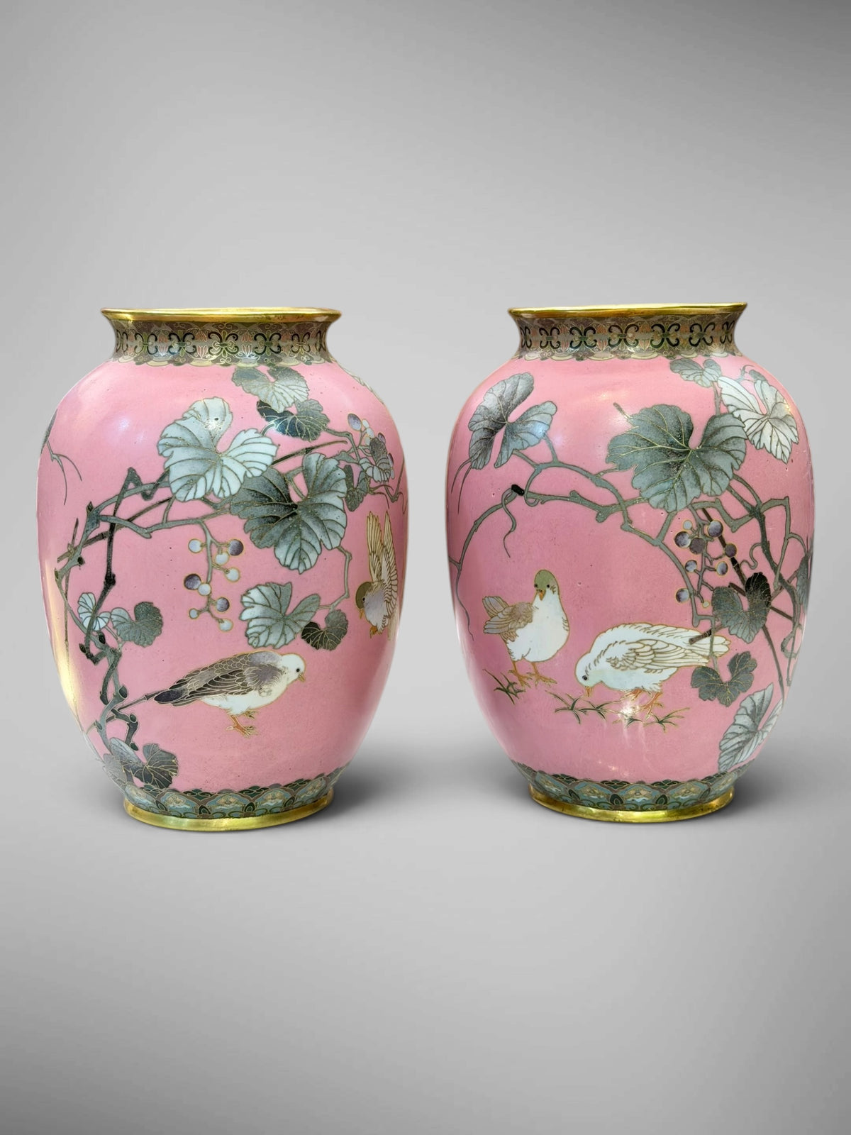 A FINE PAIR OF JAPANESE CLOISONNÉ ENAMEL VASES WITH BIRDS AND GRAPEVINE, IN THE MANNER OF NAMIKAWA SŌSUKE-Meiji period
