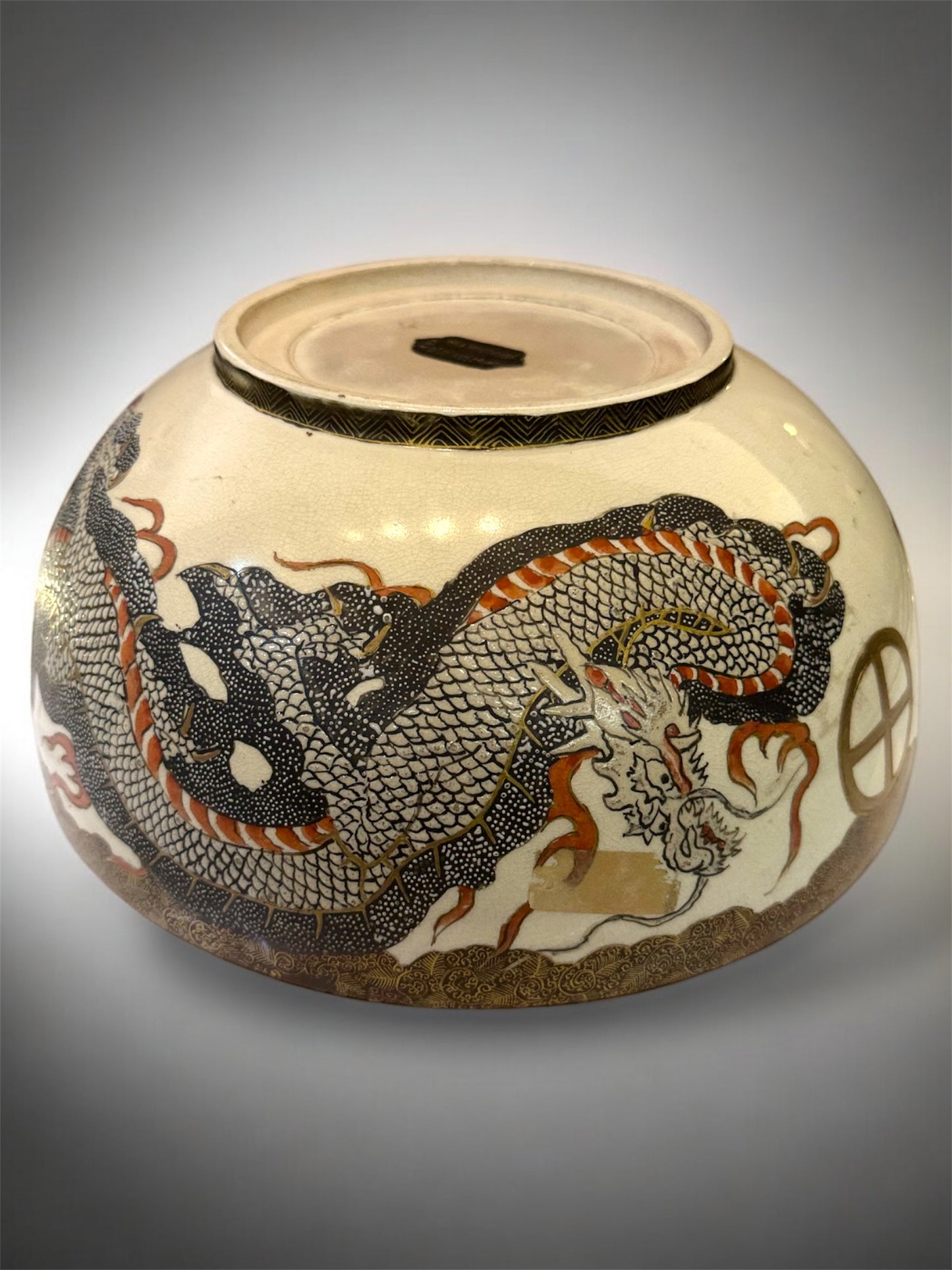 A Large Japanese Satsuma Bowl -Dragon and 100 Rakan. Signed .Meiji Era