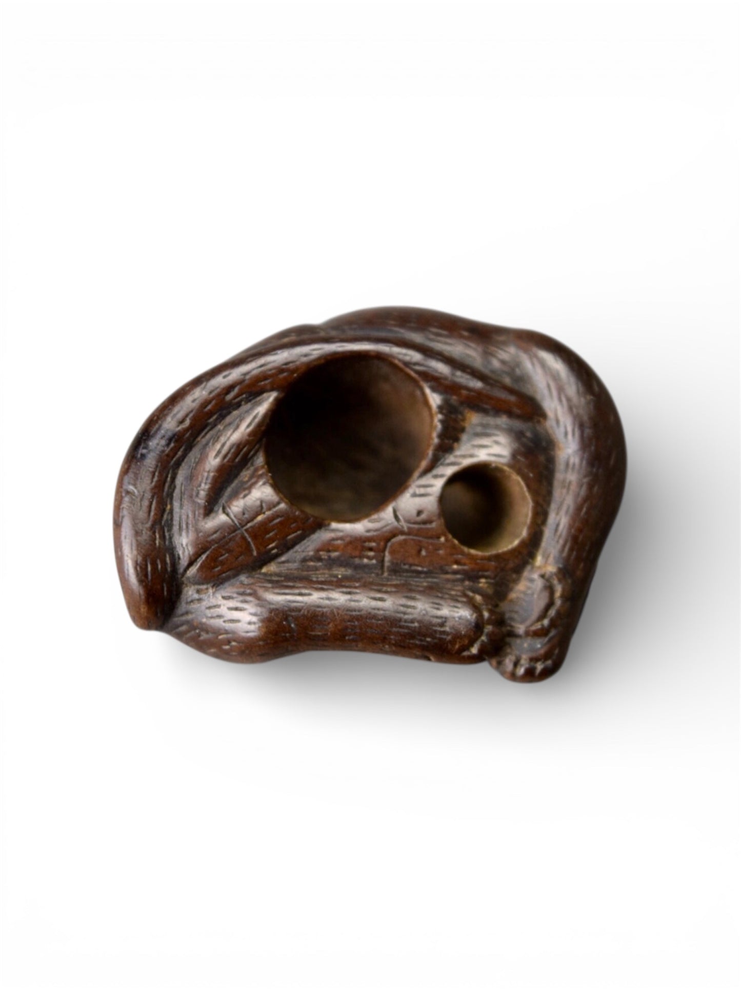 A Japanese wood netsuke of a sleeping cat, Edo period