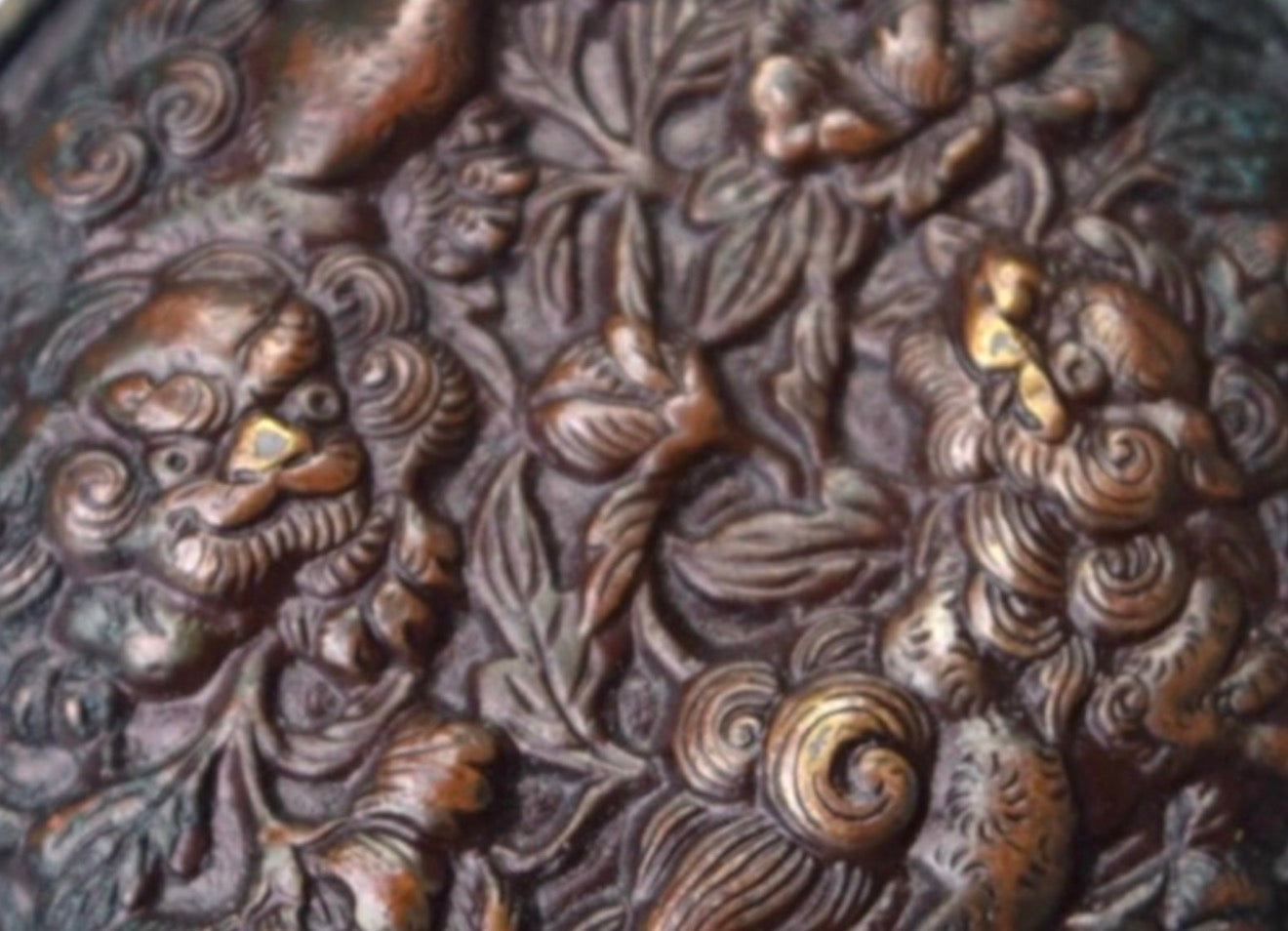 A Fine Japanese Bronze Manju Netsuke with Shishi and Peony, Meiji period