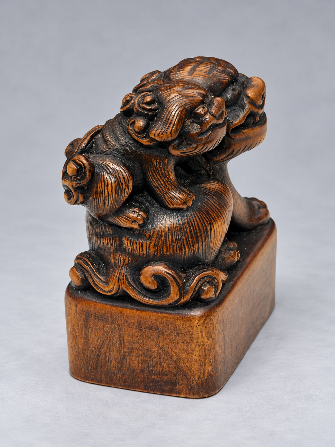 A Superb Wood Seal-Type (Ingyō) Netsuke of a Shishi and Cub

Japan, Meiji period (1868–1912)