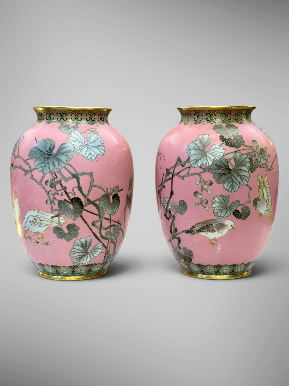 A FINE PAIR OF JAPANESE CLOISONNÉ ENAMEL VASES WITH BIRDS AND GRAPEVINE, IN THE MANNER OF NAMIKAWA SŌSUKE-Meiji period