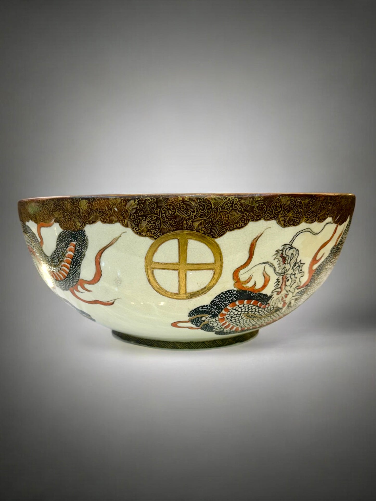 A Large Japanese Satsuma Bowl -Dragon and 100 Rakan. Signed .Meiji Era