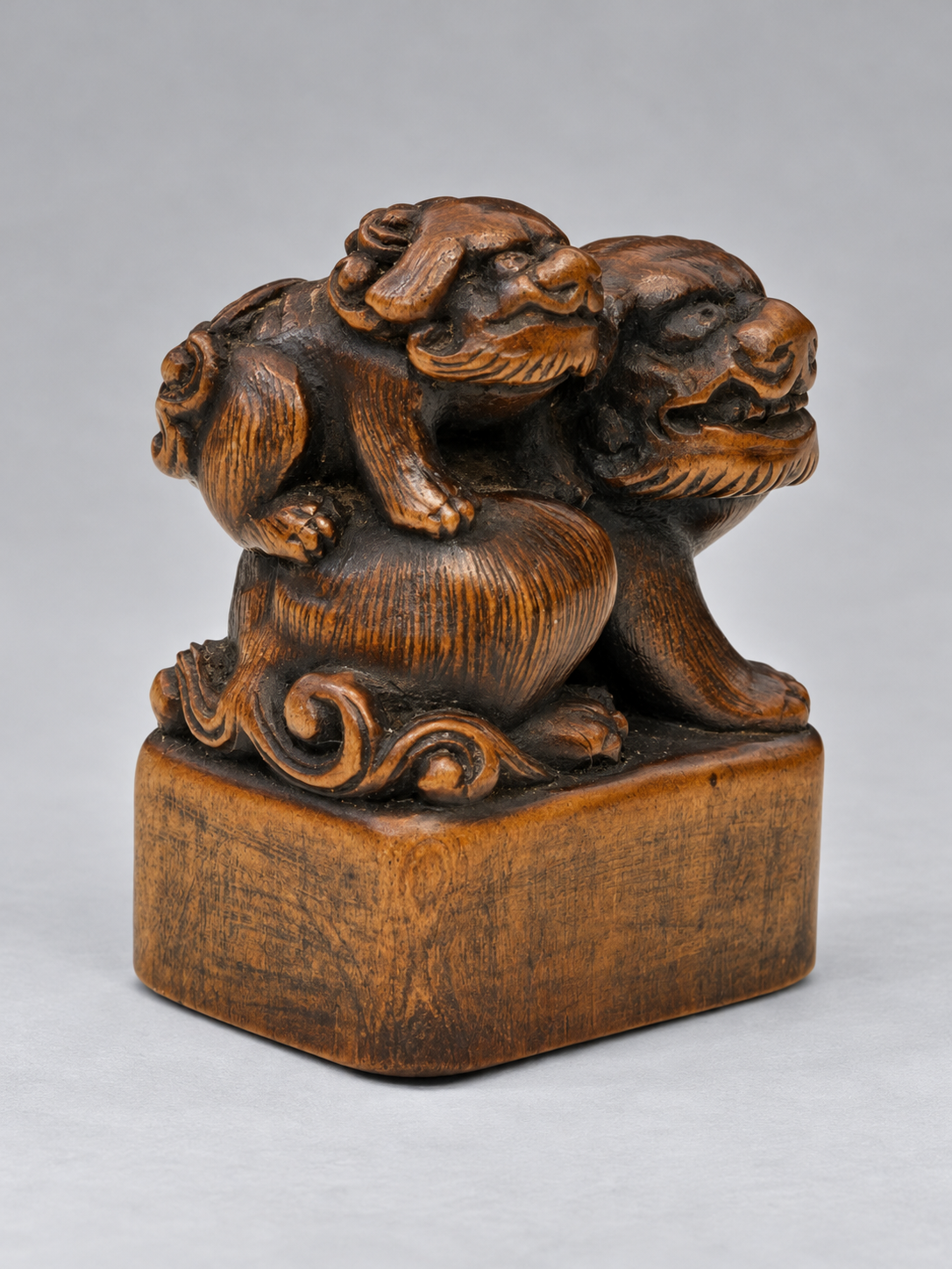 A Superb Wood Seal-Type (Ingyō) Netsuke of a Shishi and Cub

Japan, Meiji period (1868–1912)