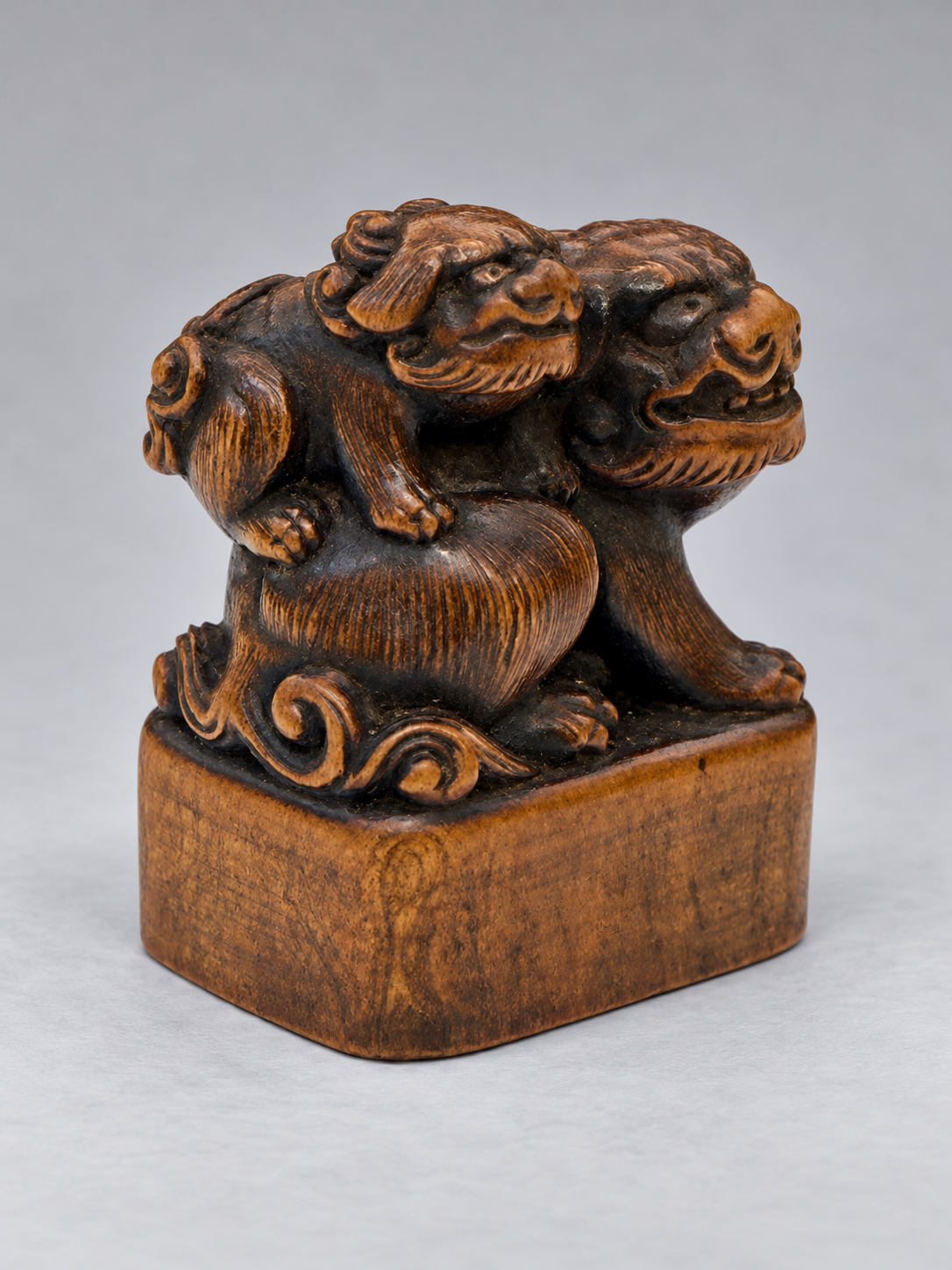 A Superb Wood Seal-Type (Ingyō) Netsuke of a Shishi and Cub

Japan, Meiji period (1868–1912)