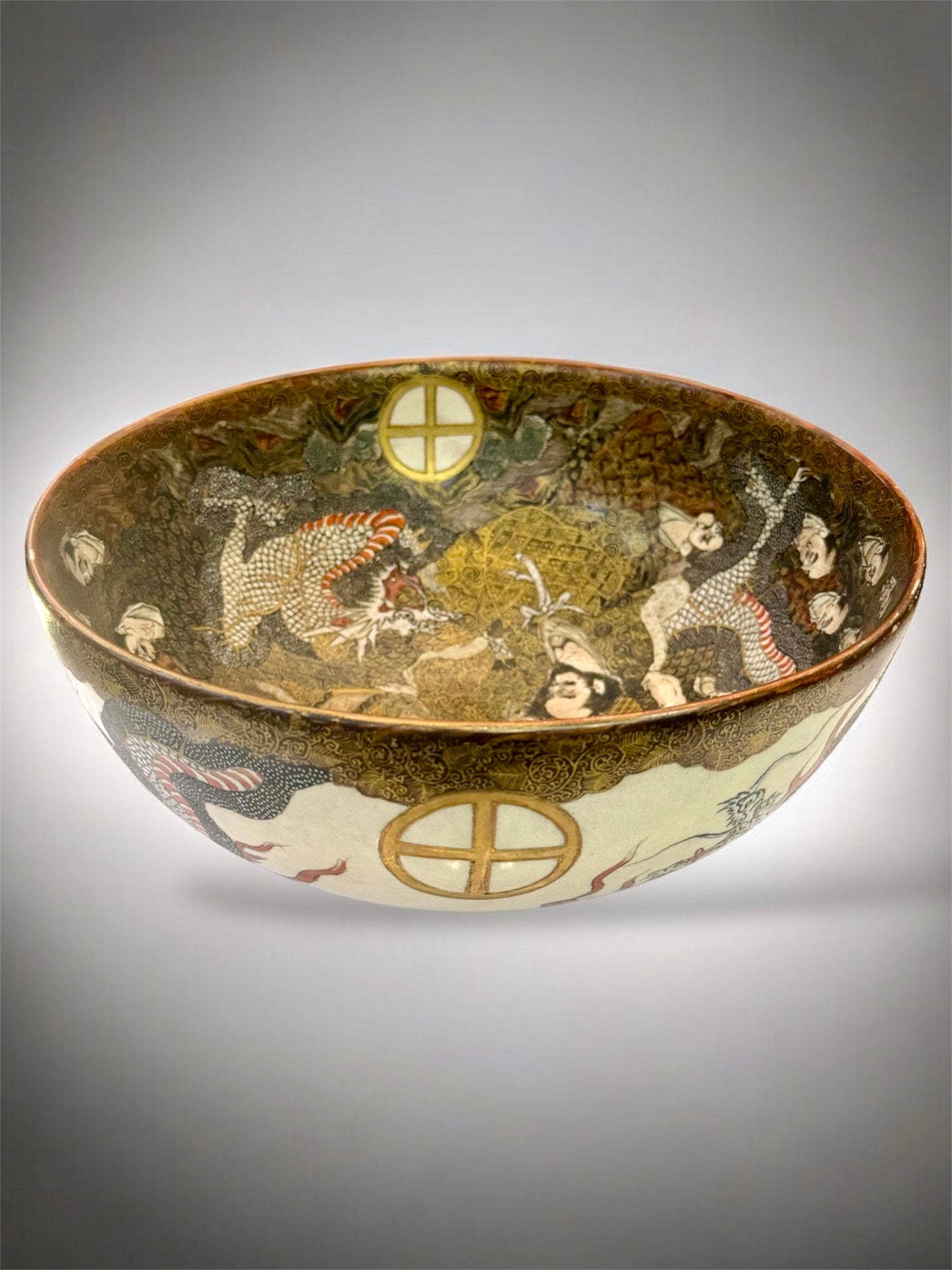 A Large Japanese Satsuma Bowl -Dragon and 100 Rakan. Signed .Meiji Era