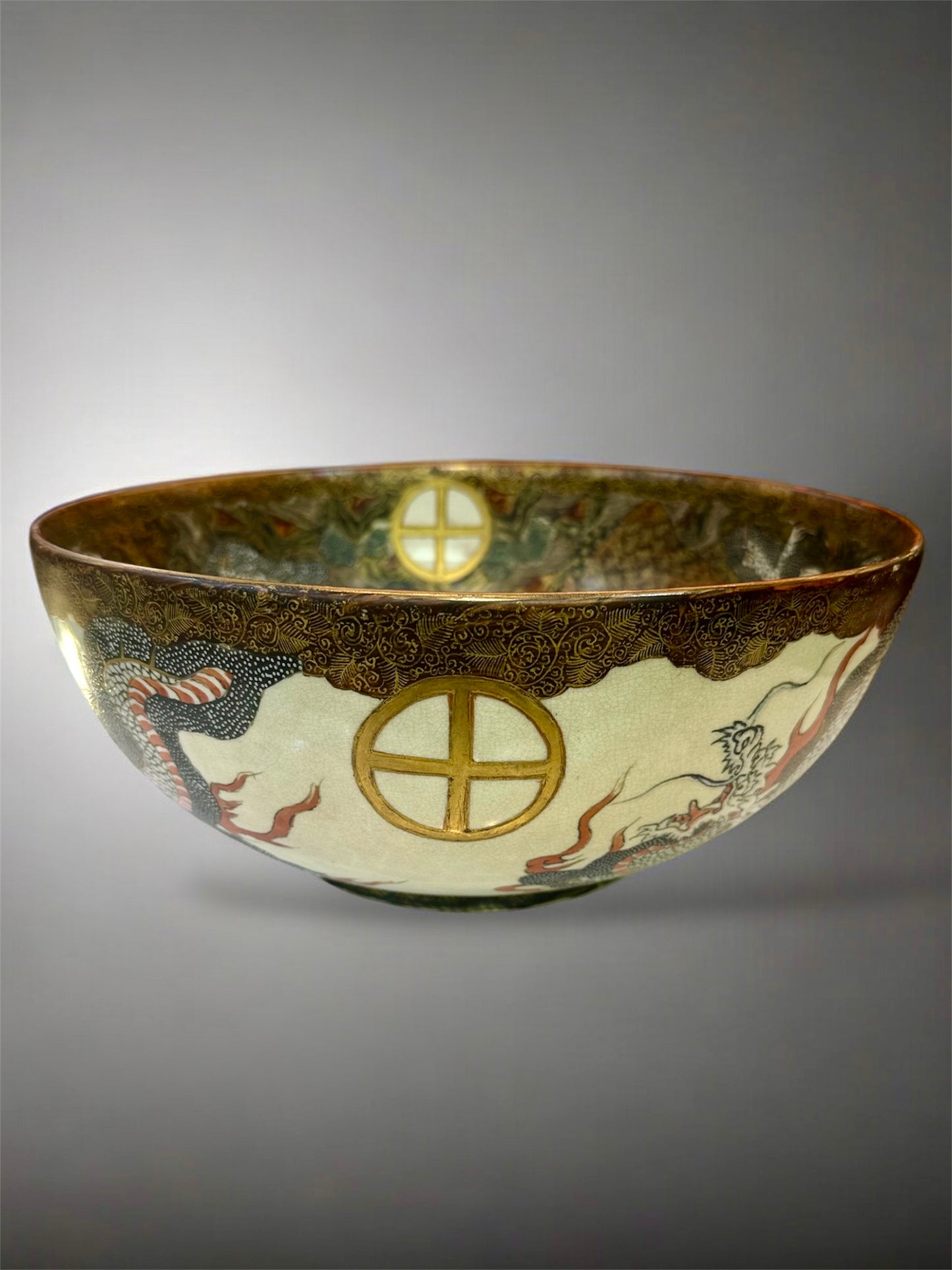 A Large Japanese Satsuma Bowl -Dragon and 100 Rakan. Signed .Meiji Era
