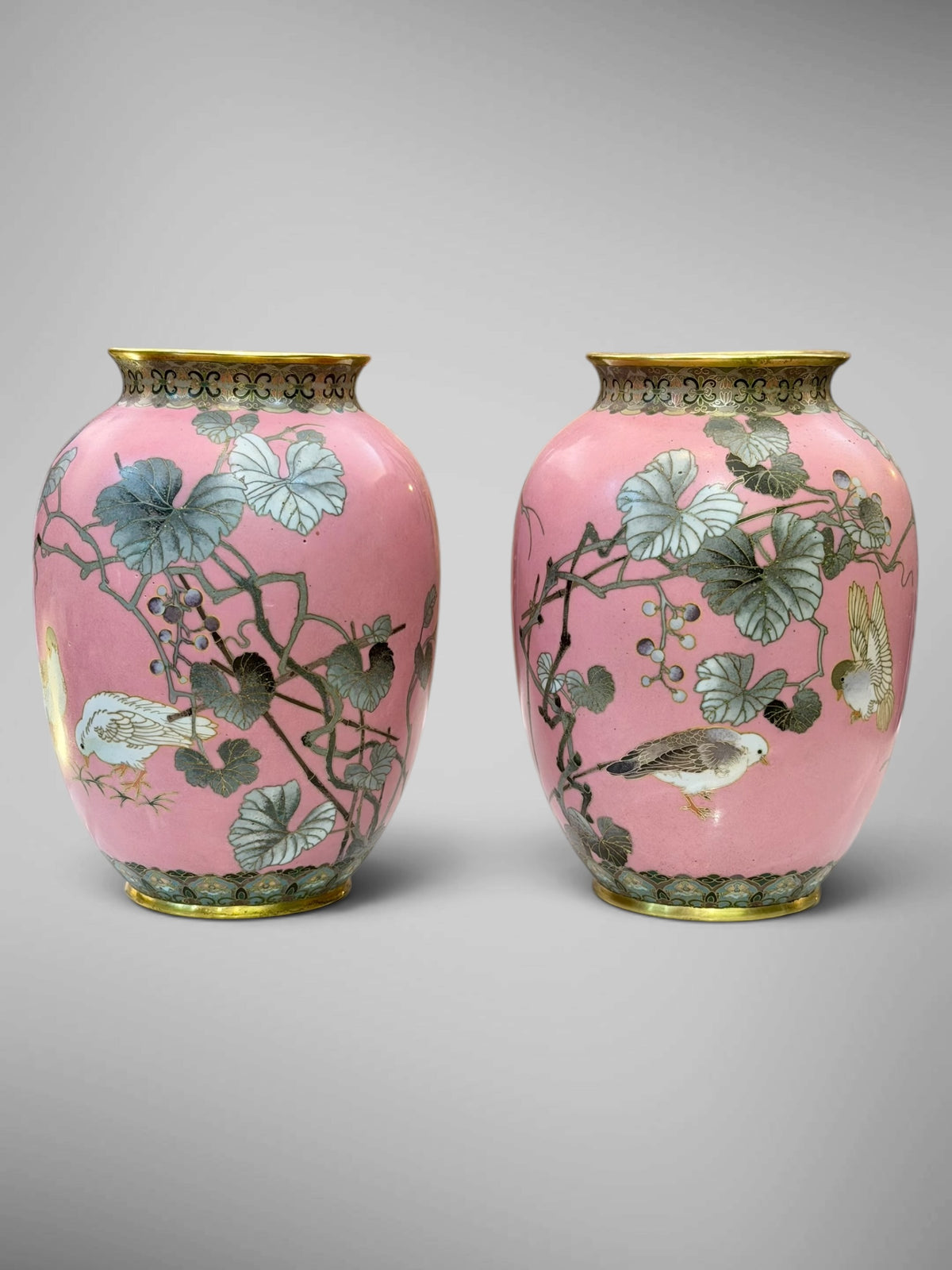 A FINE PAIR OF JAPANESE CLOISONNÉ ENAMEL VASES WITH BIRDS AND GRAPEVINE, IN THE MANNER OF NAMIKAWA SŌSUKE-Meiji period